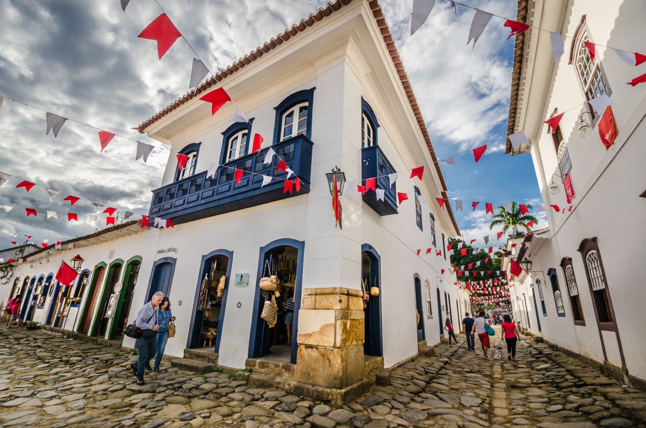 Colonial street in Paraty decorated with colorful flags during a festival