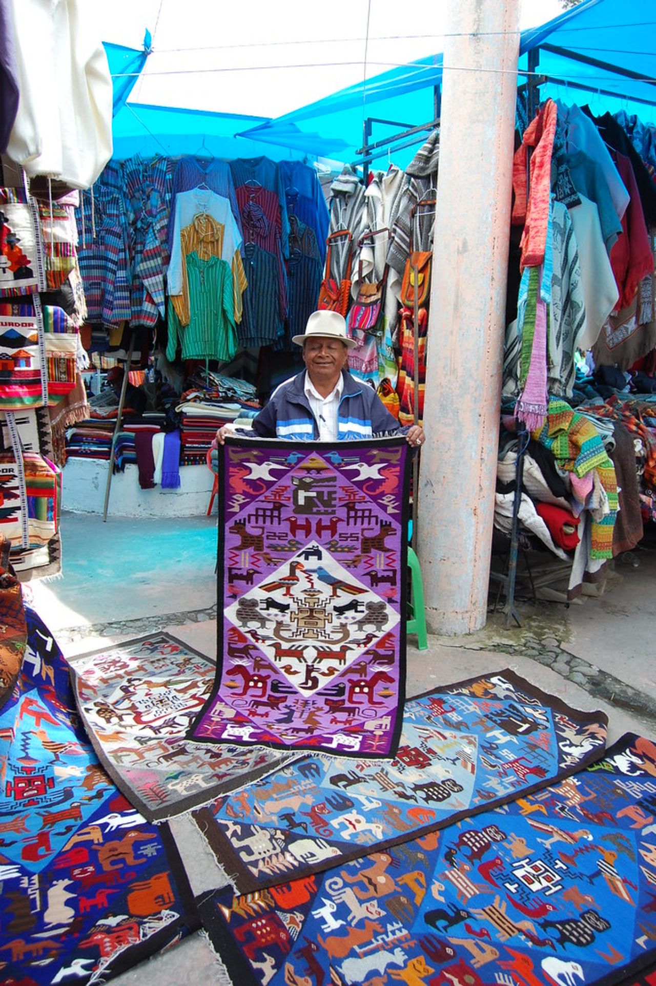 Otavalo artisan showcasing textiles on Ecuador cultural tours